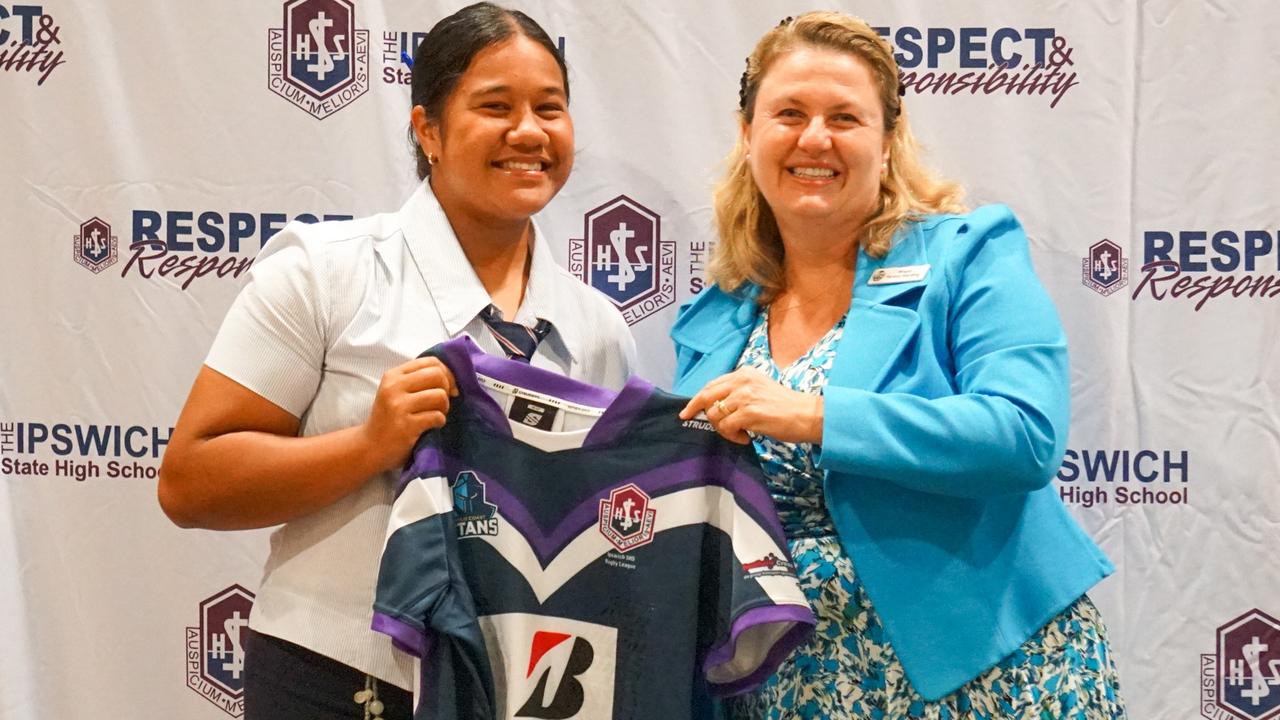 Mayor Teresa Harding presenting Ipswich SHS Girls Open Captains jersey to Sky-Yvette Faimalie before the school rugby league season.