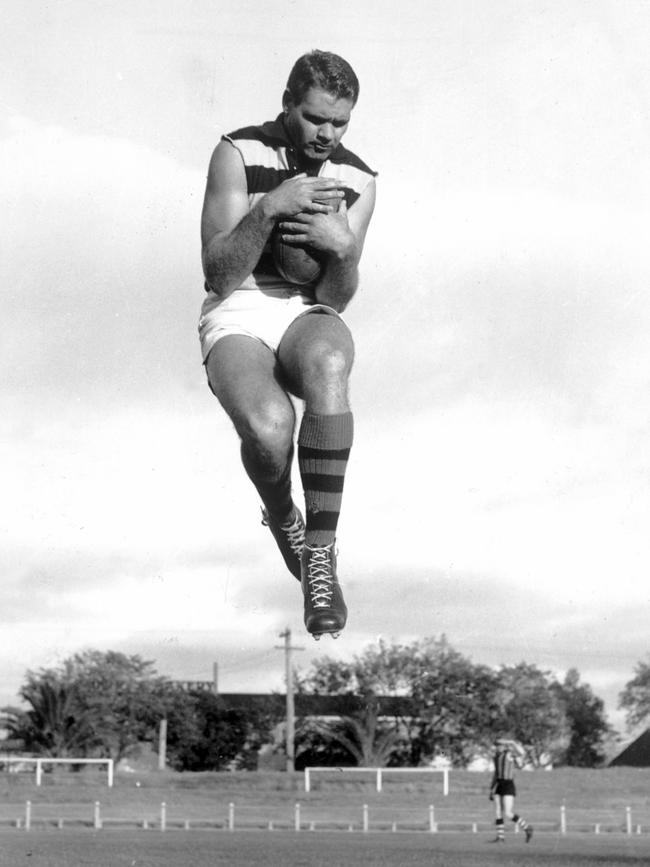 Farmer leaps for a mark in 1962.