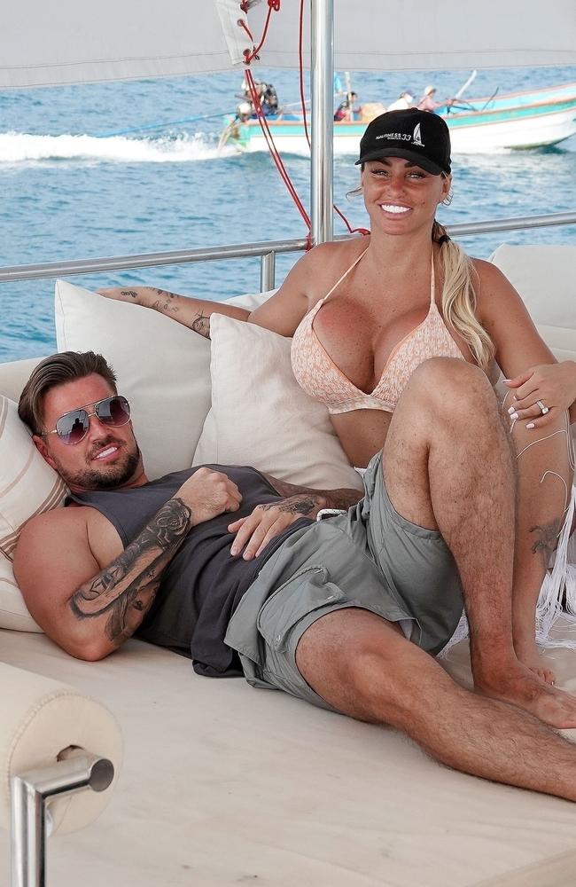 Katie Price relaxes with fiance Carl Woods. Picture: BackGrid