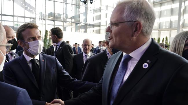 Scott Morrison greets French President Emmanuel Macron in Rome during the G20. Picture: Adam Taylor