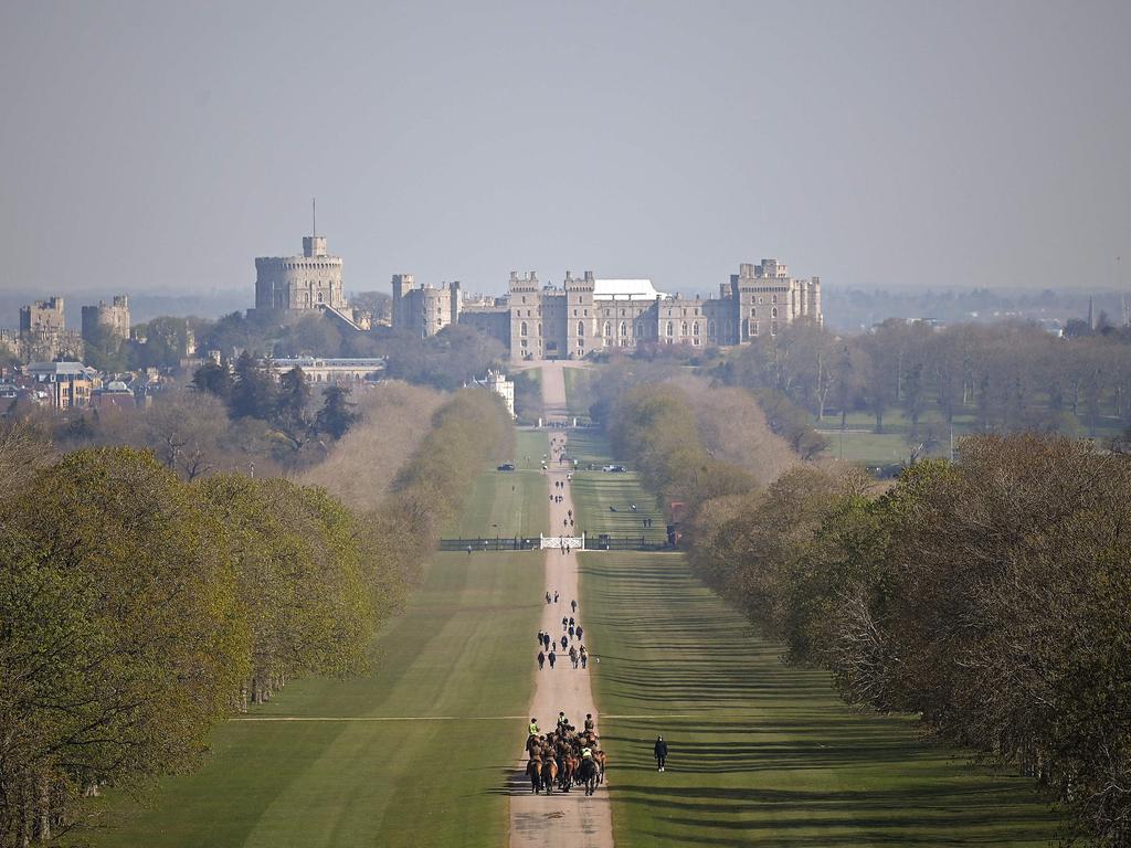 A mounted regiment of the British Army exercise their horses along The Long Walk, leading to Windsor Castle in Windsor Great Park, west of London. Picture: AFP