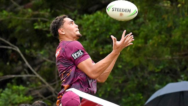 Xavier Coates flies high at Broncos training. Picture: John Gass