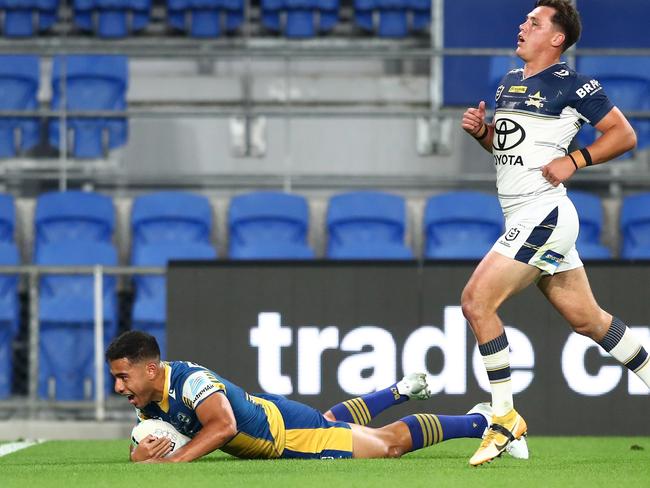 Will Penisini (L) scored his first NRL try on Saturday night. (Photo by Chris Hyde/Getty Images)