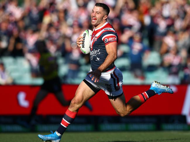 Try again ... James Tedesco of the Roosters scores against the Knights.