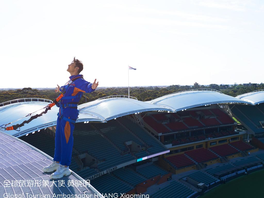 Huang Xiaoming hangs off the edge of the Adelaide Oval roof. Picture: South Australian Tourism Commission