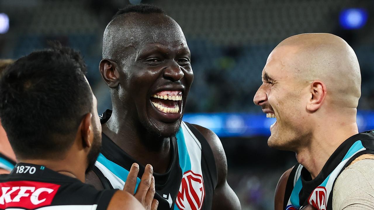 Aliir Aliir with fellow dads Sam Powell-Pepper and Junior Rioli. Picture: Dylan Burns/AFL Photos via Getty Images