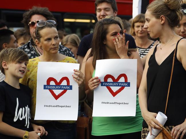 People take part in a vigil at Finsbury Park in north London. Picture: Frank Augstein/AP