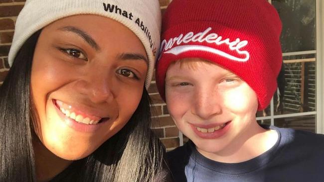 Giants netball player Kristina Manu’a with a What Ability participant. Picture: Supplied.