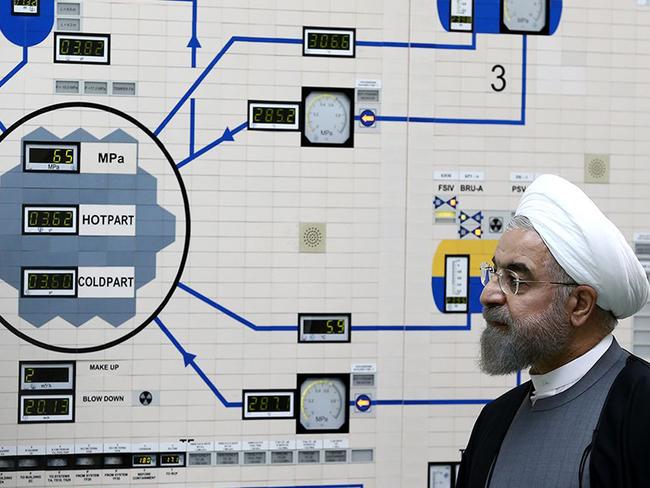 (FILES) In this file handout photo taken on January 13, 2015 from the official website of the Iranian President Hassan Rouhani, shows him visiting the control room of the Bushehr nuclear power plant in the Gulf port city of Bushehr. - Iran said Wednesday it will stop respecting limits on its nuclear activities agreed under a landmark 2015 deal unless other powers help Tehran bypass renewed US sanctions, amid rising tensions with Washington. (Photo by Handout / Iranian Presidency / AFP)