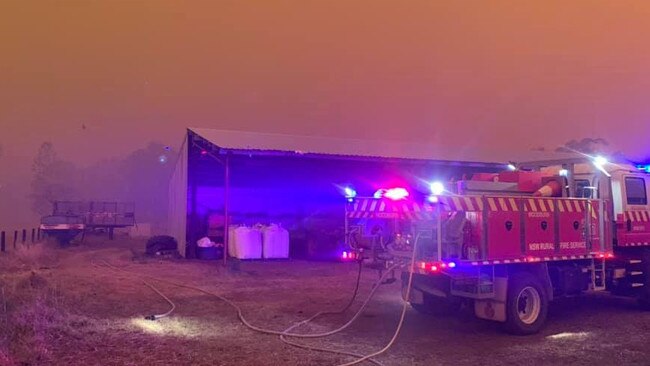 CHRISTMAS EVE: Today is day 111 of the Northern Rivers bushfires burning continuously in the region. Image shows RFS firefighters along the Coraki-Ellangowan Rd on December 7.