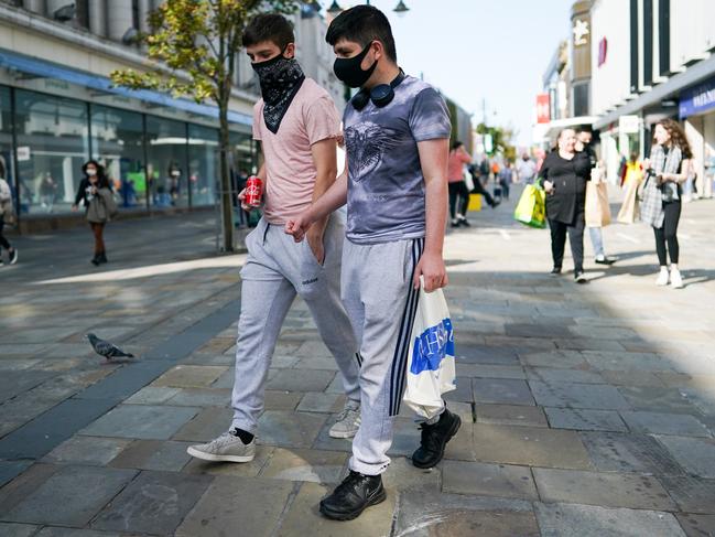 The new normal. Two men shop in the English city of Newcastle. Picture: Getty Images