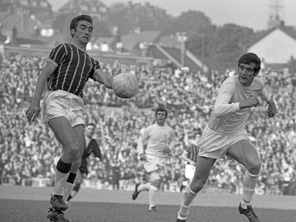 Leeds legend Norman Hunter (R) passed away after contracting coronavirus in 2020. Hunter marks Crystal Palace’s Gerry Queen during a Football League Div 1 match in 1969. Picture: <span>Ian McLennan/Getty Images</span>