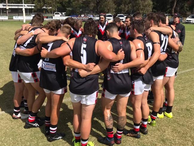 Devon Meadows link arms before taking on Pearcedale. Picture: Devon Meadows FNC