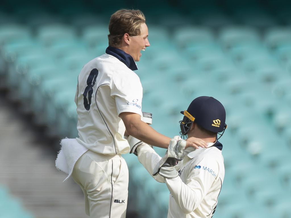 Wil Parker of Victoria celebrates his maiden first class wicket