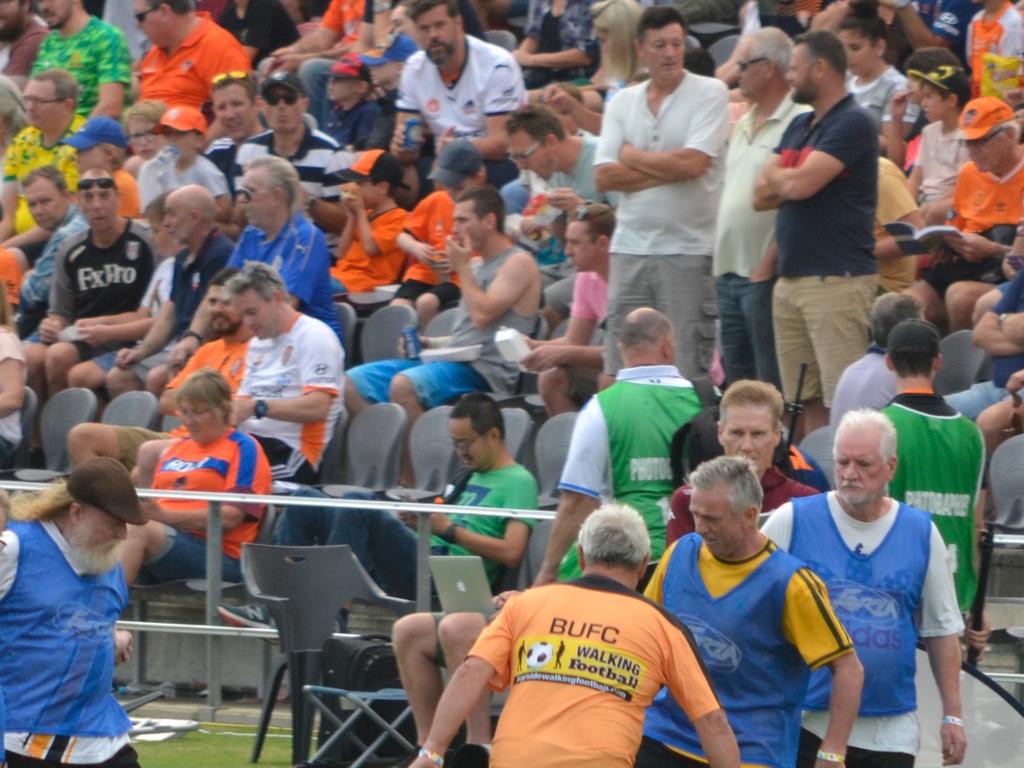 Henri Rennie (left) and Scott Lynch (yellow sleeves) in action against Bayside United.