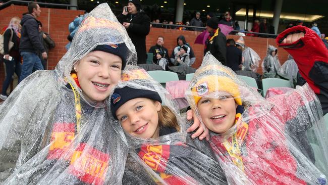 Crows fans the Chandler kids, Luka, 14, Stella, 8, and Levi, 12, came all the way from Cummins on the West Coast. Picture: AAP Image/Dean Martin.