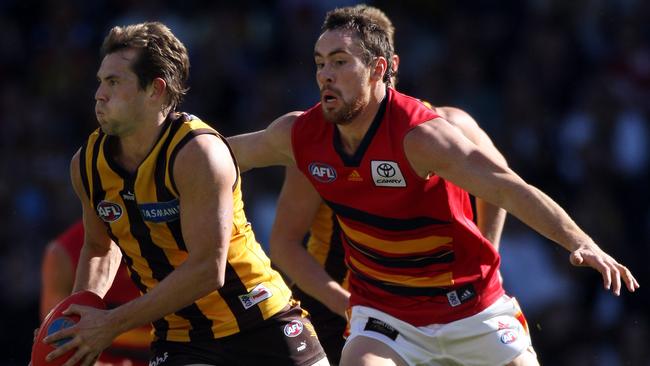 Luke Hodge dashes away from Adelaide’s Ben Hudson during Hodge’s first final in 2007.