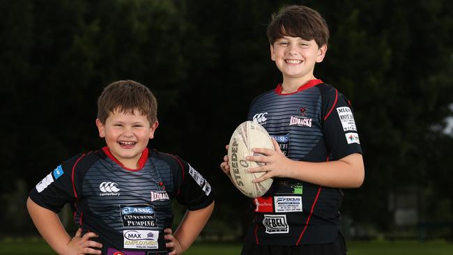 Brodie Simmons, 6, and Bailey Simmons, 12, of Mudgeeraba Redbacks junior Rugby League team, Mudgeeraba, Gold Coast. To go with story on the increase in participation in the local league. Picture: Regi Varghese