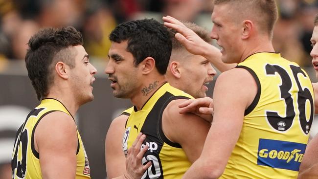 Marlion Pickett of the Tigers is congratulated by his teammates after kicking a goal during the VFL Grand Final match between the Williamstown Seagulls and the Richmond Tigers at Ikon Park in Melbourne, Sunday, September 22, 2019.  (AAP Image/Scott Barbour) NO ARCHIVING, EDITORIAL USE ONLY