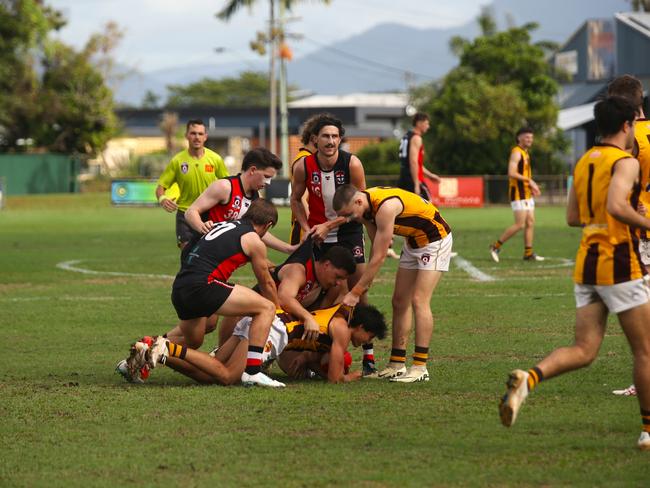 Pictured (l-r): Saints Connor Kirtley, Ashley Moore, Riley McCall, Zavier Ballis. Hawks Matthew White, Jack Ormay and Joshua Gardner. Manunda Hawks v Cairns Saints at Griffiths Park. Round 10 AFL Cairns 2024. Picture: Gyan-Reece Rocha