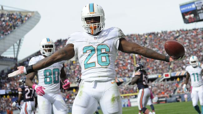 Lamar Miller showboats after his touchdown during the third quarter.