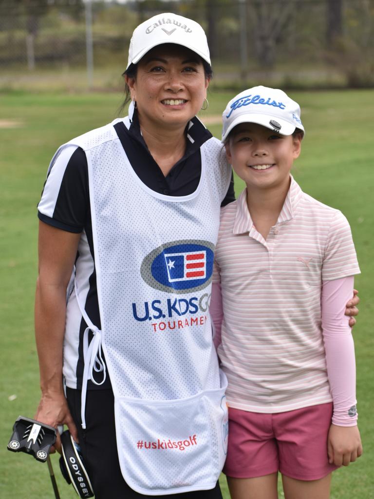 Sydney's Adeline Yeung with player Alexandra Thorne (girls nine to 10 years) at the US Kids Golf Foundation Australian Open at the Rockhampton Golf Club on September 28.