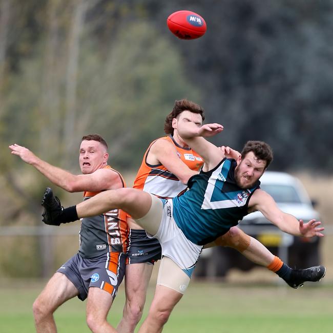 CDHBU player Cody Kuschert is outnumbered by two RWWW opponents, Jack Duck and Mitch Thomas. Picture: Yuri Kouzmin