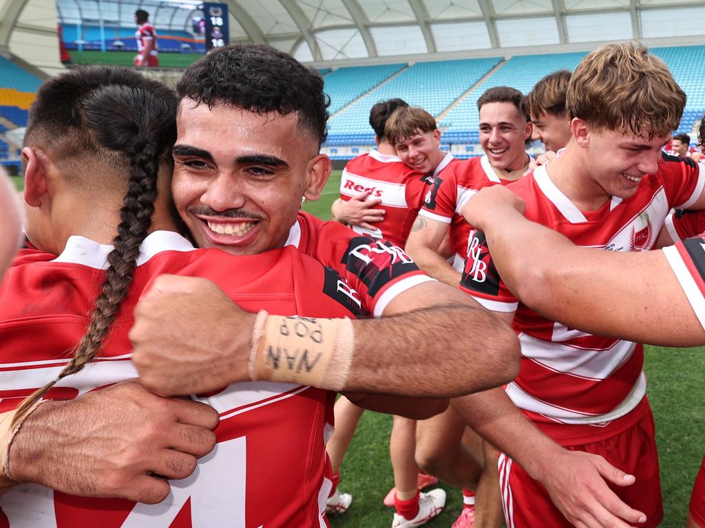 NRL National Schoolboys Cup final at CBUS Stadium between Palm Beach Currumbin and Patrician Blacktown Brothers. The Red Army and Palm Beach Currumbin players celebrate the win. .Picture Glenn Hampson