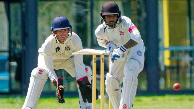 Sunshine keeper Matt Stone and Footscray United batter Sanju Jayasekara. Picture: Valeriu Campan