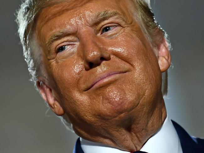 US President Donald Trump looks on after delivering his acceptance speech for the Republican Party nomination for reelection during the final day of the Republican National Convention at the South Lawn of the White House in Washington, DC on August 27, 2020. (Photo by Brendan Smialowski / AFP)