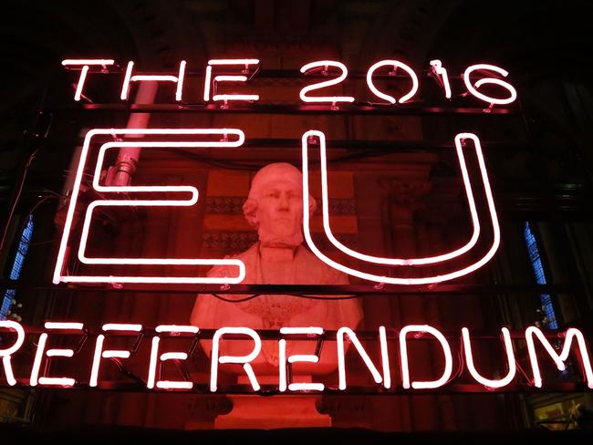 A neon sign for the 2016 referendum is attached to the doors of the announcement hall in Manchester Town Hall , northwest England on June 23, 2016 where the final result of a referendum on whether the UK will remain or stay in the European Union (EU) will be announced. Britain has voted to leave the European Union by 52 percent to 48 percent, the BBC reported on Friday, after nearly all the results had been counted. / AFP PHOTO / POOL / Rob Stothard