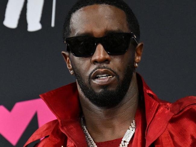 (FILES) US producer-musician Sean "Diddy" Combs poses with the Global Icon award in the press room during the MTV Video Music Awards at the Prudential Center in Newark, New Jersey, on September 12, 2023. The music industry has long evaded a #MeToo reckoning like that experienced in Hollywood or the media, but the blockbuster charges against hip hop magnate Sean Combs could finally prove an inflection point. (Photo by ANGELA WEISS / AFP)