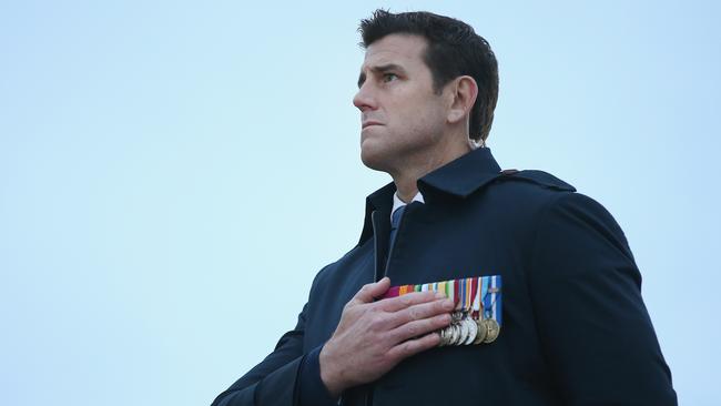 ECEABAT, TURKEY - APRIL 25: Distinguished Australian war veteran Ben Roberts-Smith, who is a recipient of the Victoria Cross Australia, holds his hand over his heart as the Australian national anthem is played at the Dawn Service at the Anzac Commemorative Site, which is the main event to commemorate Australian and New Zealand soldiers who died during the Gallipoli campaign, on the campaign's centenary on April 25, 2015 near Eceabat, Turkey. Turkish and Allied powers representatives, as well as family members of those who served, are commemorating the 100th anniversary of the Gallipoli campaign with ceremonies at memorials across the Gallipoli Peninsula. The Gallipoli land campaign, in which a combined Allied force of British, French, Australian, New Zealand and Indian troops sought to occupy the Gallipoli Peninsula and the strategic Dardanelles Strait during World War I, began on April 25, 1915 against Turkish forces of the Ottoman Empire. The Allies, unable to advance more than a few kilometers, withdrew after eight months. The campaign cost the Allies approximately 50,000 killed and up to 200,000 wounded, the Ottomans approximately 85,000 killed and 160,000 wounded. (Photo by Sean Gallup/Getty Images)