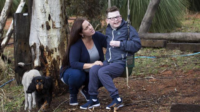 Amanda-Jane Reed with her son Taj, 12, who has cerebral palsy and autism, in Perth yesterday. Picture: Marie Nirme