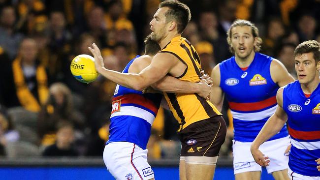 Luke Hodge breaks a tackle against the Bulldogs. Picture: Mark Stewart