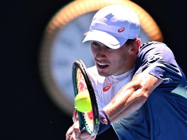 Australia's Alex de Minaur hits a return on Rod Laver Arena. Picture: William West AFP.