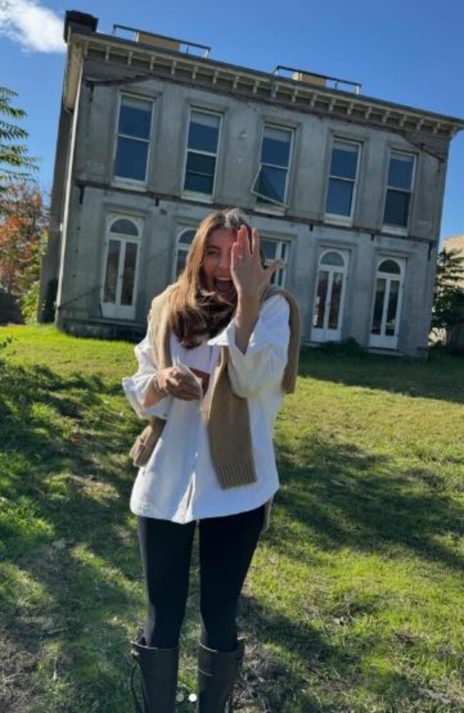 Rebecca Harding shows off her rock in front of the Kew mansion the pair are renovating.