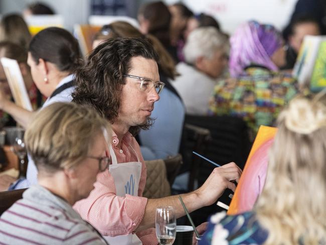 Momentum Mental Health chairman Chris Black participates in the World's Largest Paint and Sip Luncheon at Clifford Park racecourse, Friday, June 21, 2024. Picture: Kevin Farmer