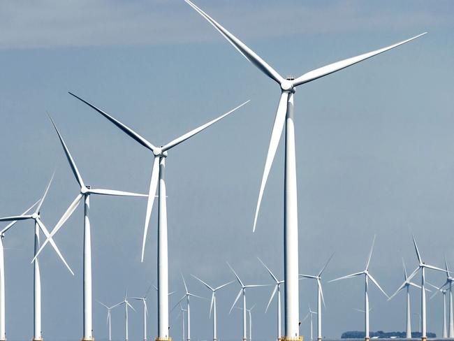 A picture taken on June 21, 2016 shows windmills at the new wind farm in Urk, The Netherlands. The forty-eight wind turbines of the largest near-shore wind farm in the Netherlands generate an amount of renewable energy that is comparable to the consumption of 160,000 households. / AFP PHOTO / ANP / Remko de Waal / Netherlands OUT