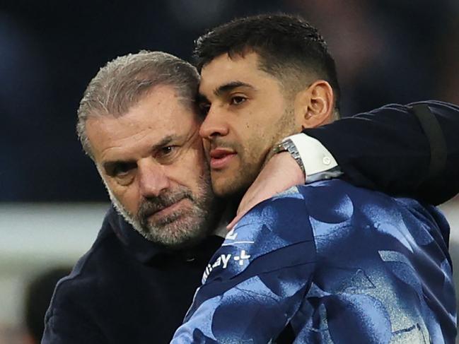 Tottenham Hotspur's Greek-Australian Head Coach Ange Postecoglou (L) celebrates with Tottenham Hotspur's Argentinian defender #17 Cristian Romero (R) on the pitch after the English Premier League football match between Tottenham Hotspur and Aston Villa at the Tottenham Hotspur Stadium in London, on November 3, 2024. Spurs won the game 4-1. (Photo by Adrian Dennis / AFP) / RESTRICTED TO EDITORIAL USE. No use with unauthorized audio, video, data, fixture lists, club/league logos or 'live' services. Online in-match use limited to 120 images. An additional 40 images may be used in extra time. No video emulation. Social media in-match use limited to 120 images. An additional 40 images may be used in extra time. No use in betting publications, games or single club/league/player publications. /