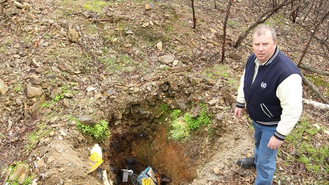 Daryl Floyd stands beside the old mine which he believes may contain the body of his missing brother Terry.