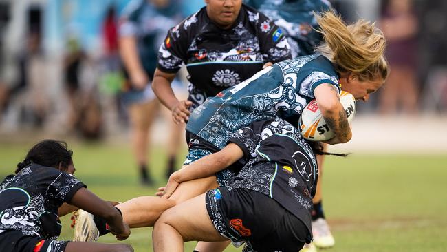 Territory All Stars player Victoria Alley is brought down by a tackle in the 2023 Deadly Cup Carnival. Picture: Pema Tamang Pakhrin