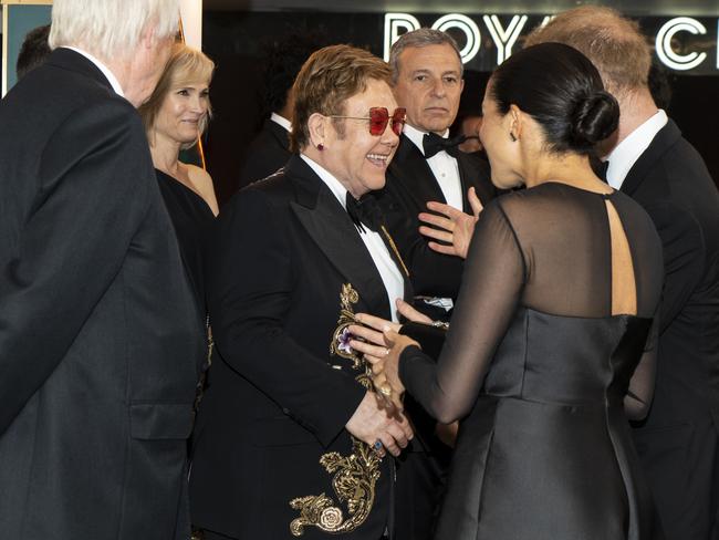 Sir Elton with Meghan and Harry at the European Premiere of Disney's The Lion King. Picture: Getty