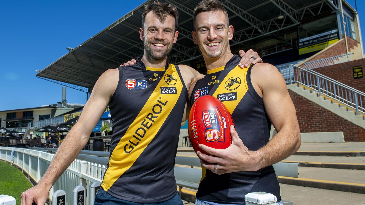 Jarryd Lyons (right) with his brother, Corey, at Glenelg Oval, after signing with the Tigers. Picture: Mark Brake