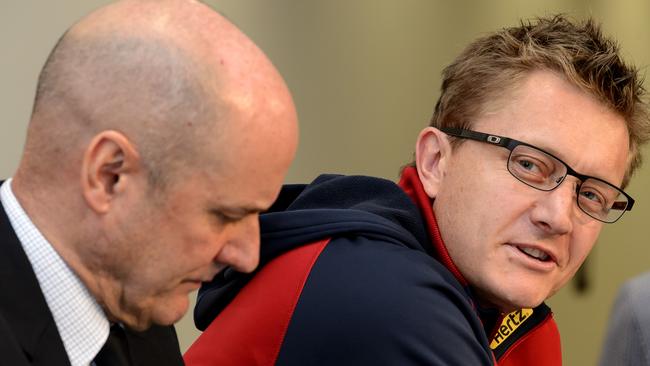 Mark Neeld looks at Peter Jackson during the press conference that announced his sacking as Melbourne coach.