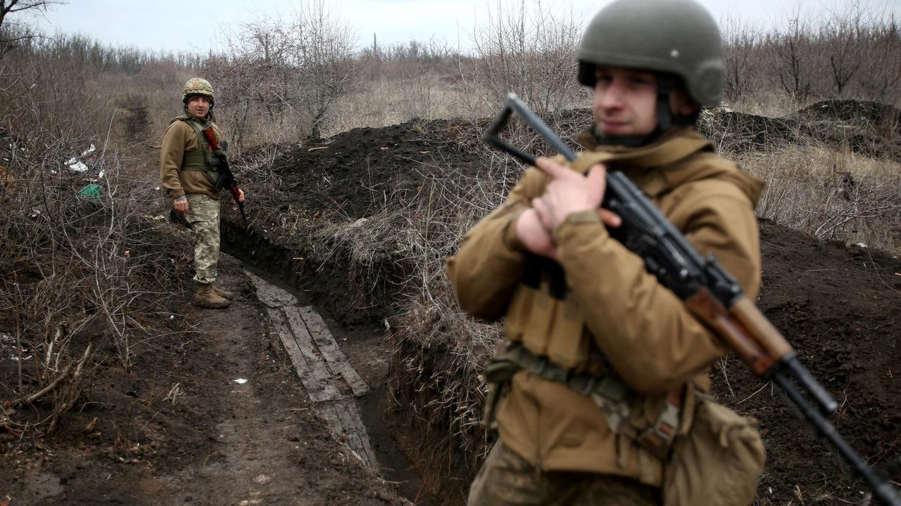 Ukrainian servicemen patrol along the front line not far from Avdiivka, in the Donetsk region. Picture: AFP