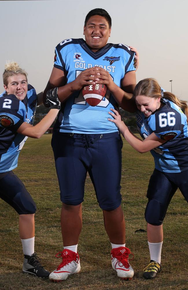 Stingrays Juniors have made it to the QLD Superbowl. The U/16 girls trtying to work out how to tackle 6’4, 140kg man mountain Matthew Ioane 16. From left, Lorrilee Clifford 15,Matthew Ioane 16, Neve Tomkins 14, training at Nerang. Picture Glenn Hamposon