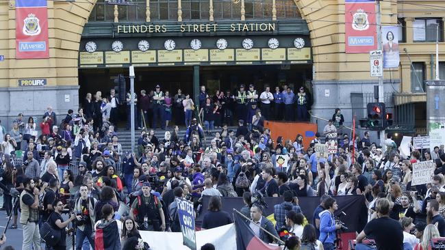 Protestors outside Flinders Street Station.