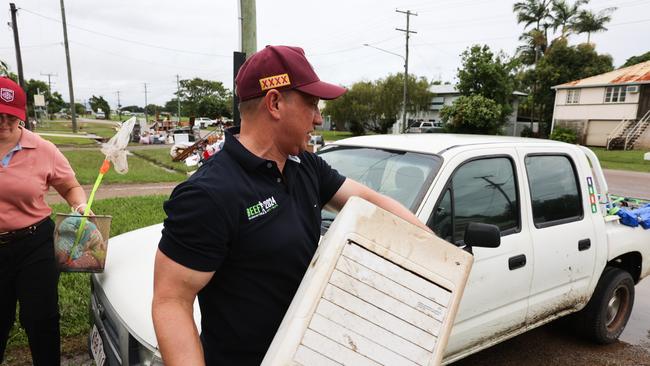 Labor Leader Steven Miles rolled up his sleeves and joined the mud army helping residents clean their flood-ravaged homes. Picture: Supplied