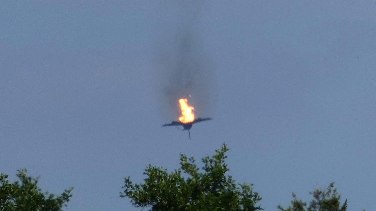 A burning aircraft of the type "Eurofighter" of the Bundeswehr is seen in the sky above Malchow on June 24, 2019. One pilot was killed after two German fighter jets collided and crashed Monday. Picture: AFP